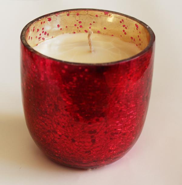 Giant red glass tumblr filled with eco-friendly soy wax