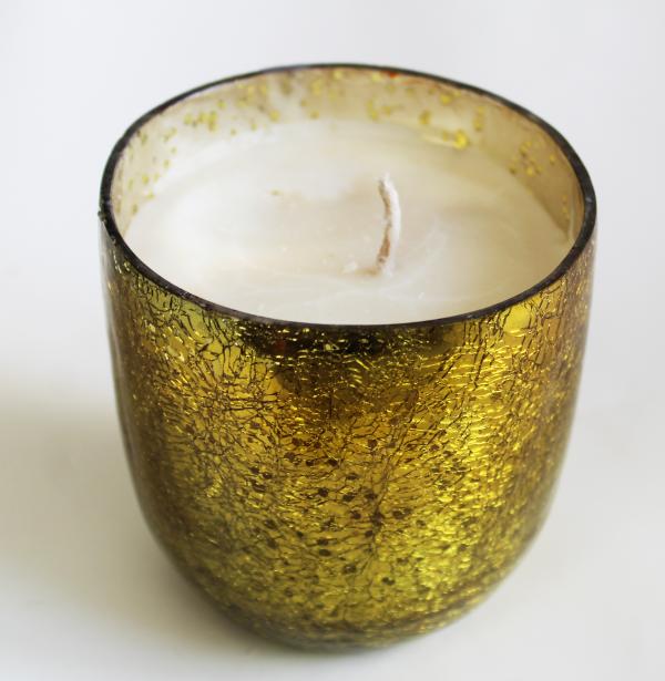 Giant yellow glass tumblr filled with eco-friendly soy wax